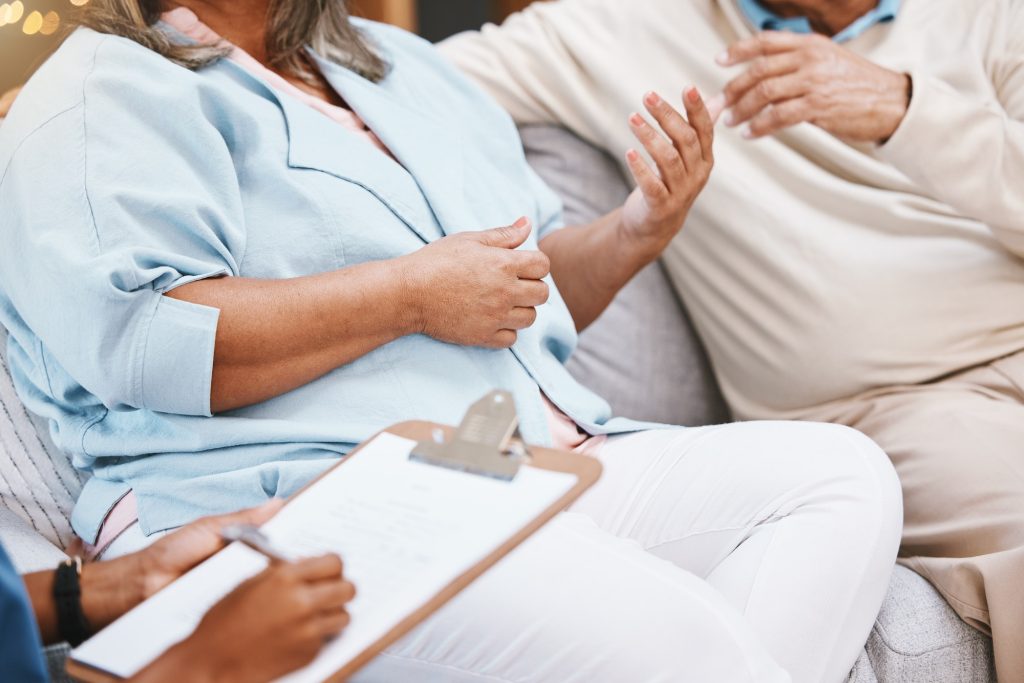 Therapy, discussion and senior couple with clipboard for argument, conversation and counseling with