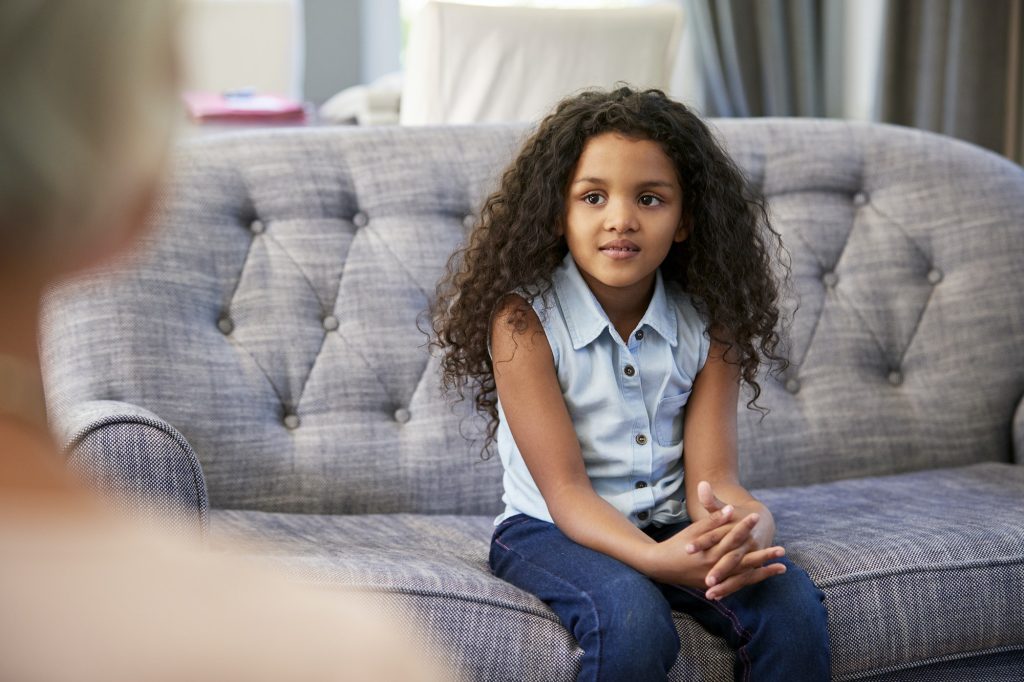 Young girl having therapy with a child psychologist