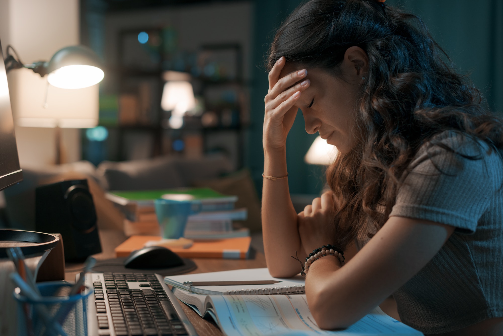 Depressed stressed woman sitting at desk