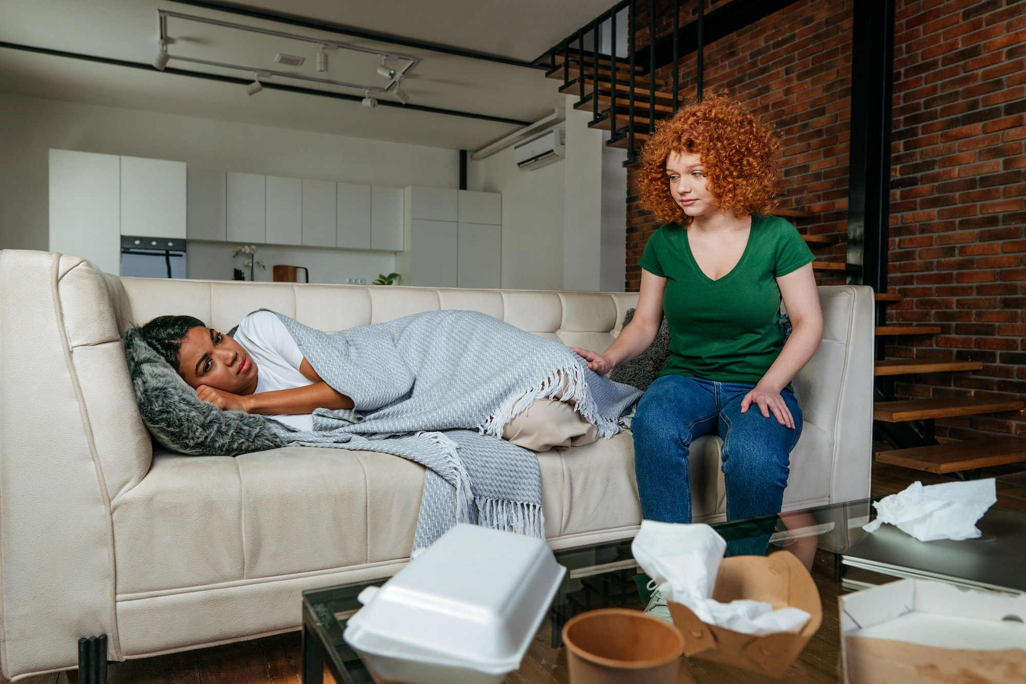 Young woman supporting her friend in depression