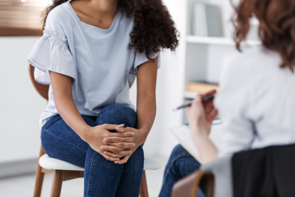 person sitting during therapy session