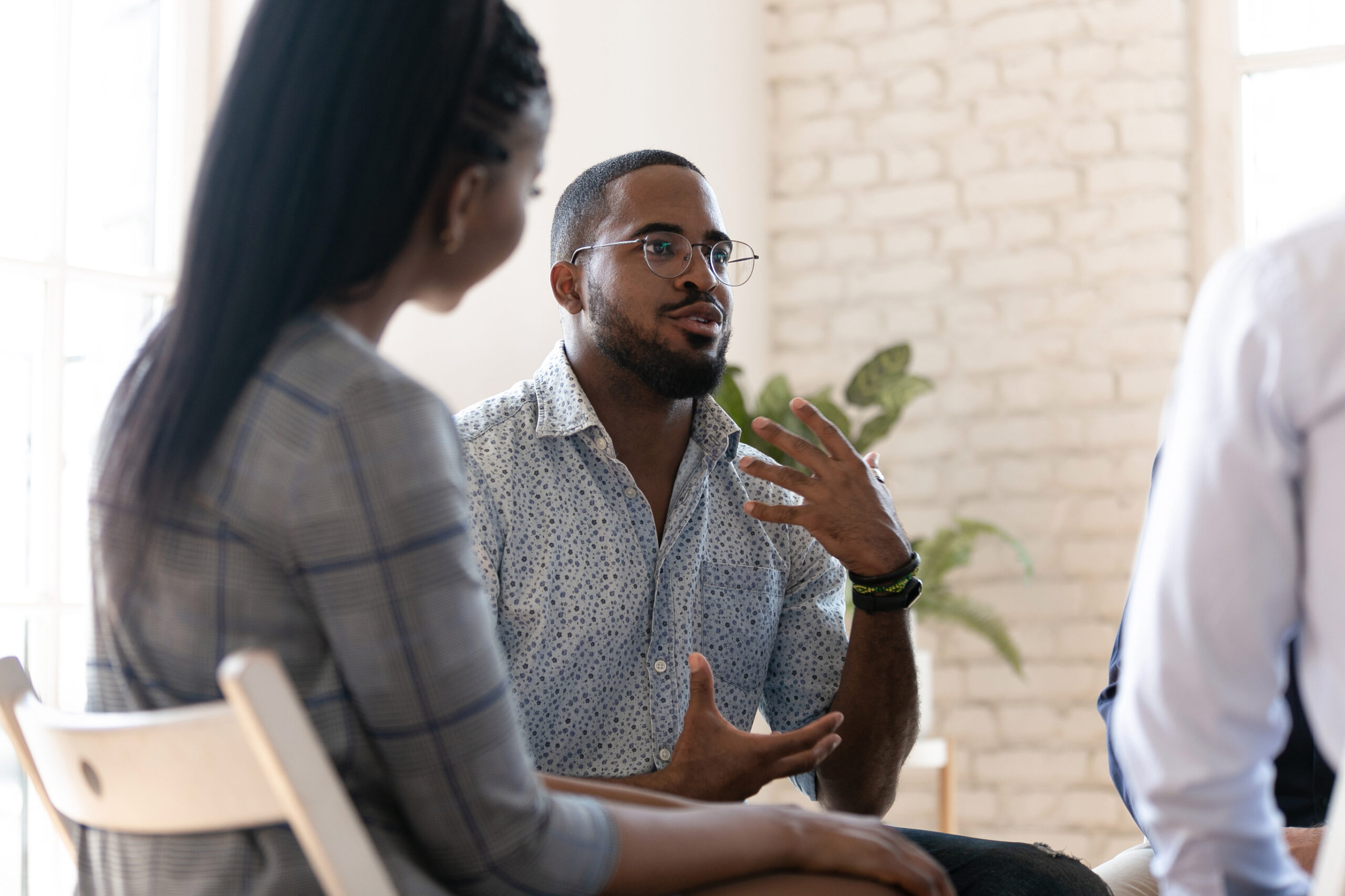 man talking during therapy session