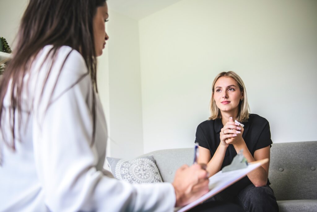 woman therapist speaking to woman client